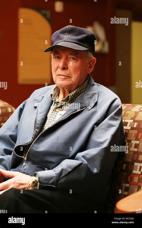 Senior man sitting in waiting room Stock Photo - Alamy