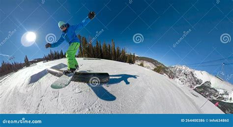 SELFIE Awesome Action Shot of a Snowboarder Sliding Along a Railing in Snow Park Stock Photo ...