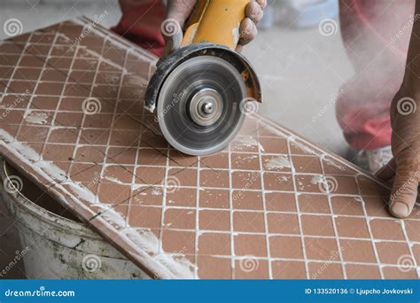 A Worker Places a Large Ceramic Tile in a Cutting Machine Stock Photo - Image of improvement ...