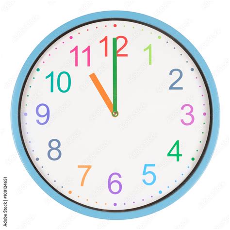 Colorful clock showing eleven o'clock Stock Photo | Adobe Stock