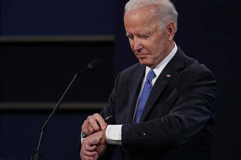 Biden checks watch to see how much time remains in debate - POLITICO