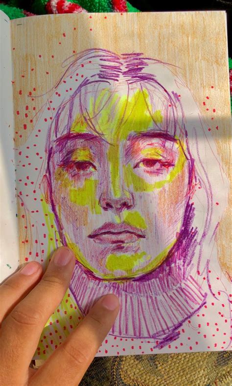 a drawing of a woman's face in colored crayon pencil on paper