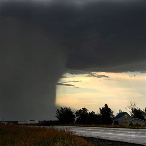 "Honey, I think it's raining!" I photographed this intense downburst at Weyburn, Saskatchewan ...