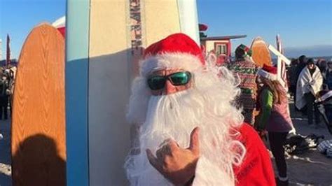 Surfing Santas hit beach in Florida cold | FL Keys News