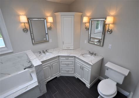 Custom Master Bathroom, with double corner vanity, tower cabinet, wall sconces, toilet and ...