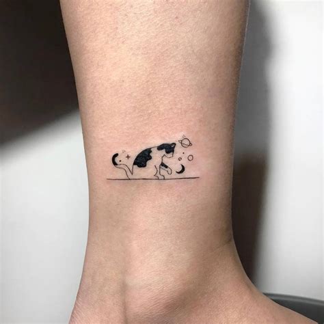 Minimalist cat tattoo on the ankle