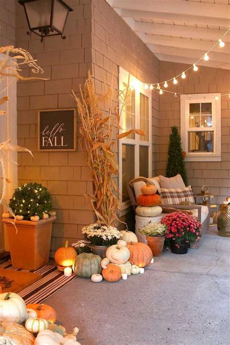 Cozy and natural fall porch decorating ideas. Create a welcoming front porch using pumpkins ...