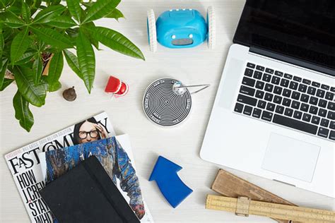 office table top with laptop, potted plant, wheeled clock … | Flickr