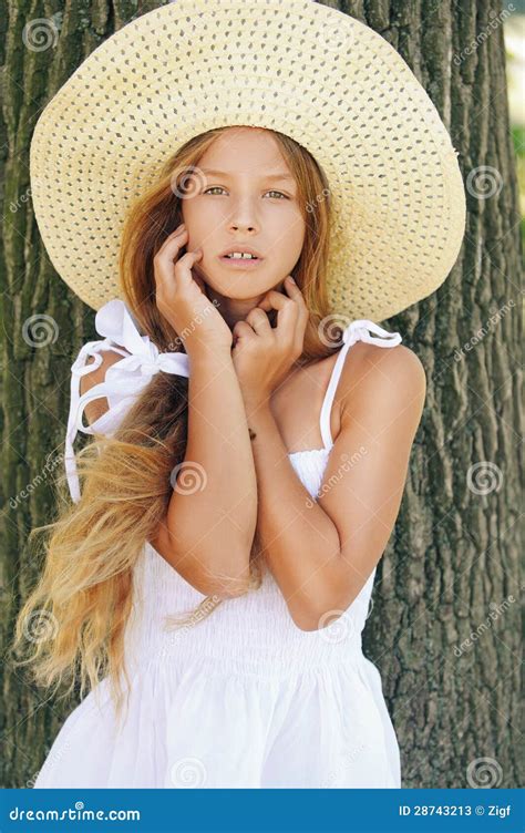 Beautiful Smiling Girl in Hat Near Stock Image - Image of bark, face: 28743213