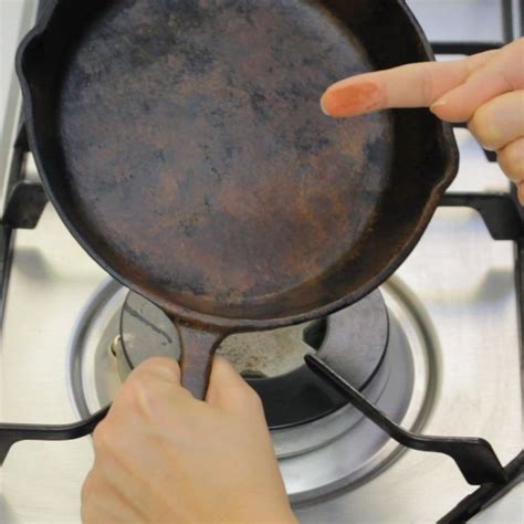 How to Clean and Reseason a Rusty Cast Iron Pan | It cast, Cleaning ...