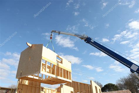 Crane lifting the framework of a house — Stock Photo © photography33 ...