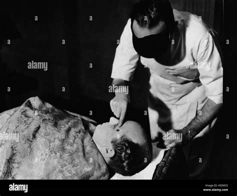 Los Angeles morgue attendant points out injuries on Ted Healy, who died on December 21, 1937 ...