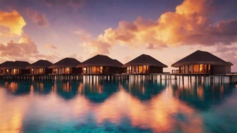 Premium AI Image | Sunset on maldives island water villas resort