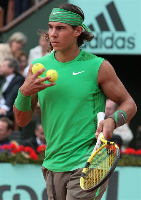 Rafael Nadal sported his signature head and wrist band in his | Iconic Tennis Outfits | POPSUGAR ...