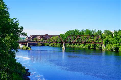 A bridge on Kennebec river stock image. Image of rail - 251250331