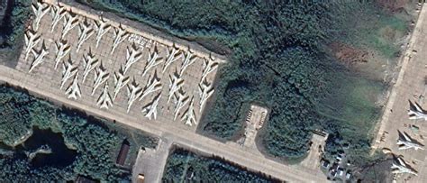 Thirty Russian TU-22M(?) bombers parked at Olenya air base, Kola Peninsula : r/aviation