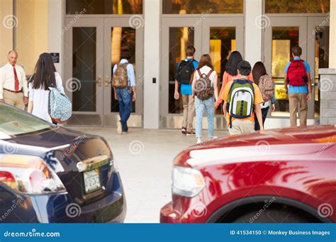 High School Students Being Dropped Off at School by Parents Stock Photo ...