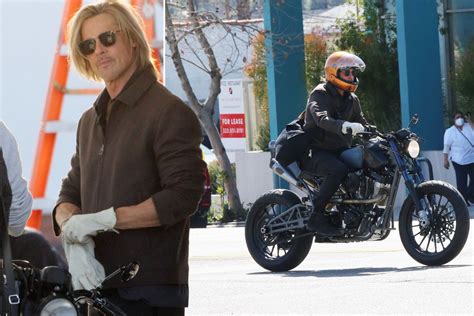 Brad Pitt cruises through LA on a motorcycle while shooting ad