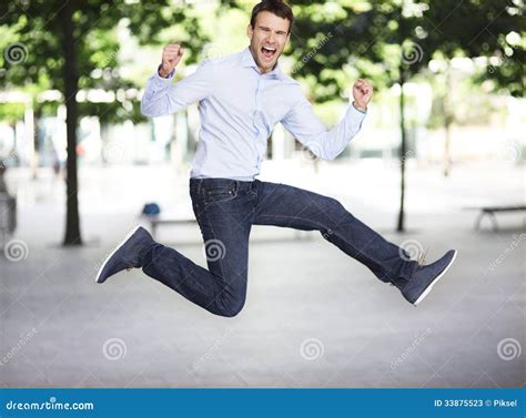 Excited man jumping stock image. Image of enthusiasm - 33875523