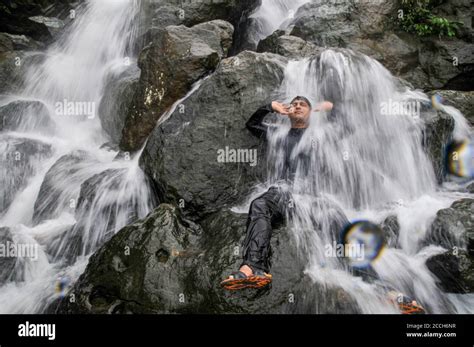 Tourists enjoying the hilly 'Mayabi Jhorna' waterfalls located at the ...