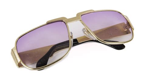 A pair of Elvis Presley TCB Neo-Style Nautic 822 sunglasses made in Germany with lavender lenses