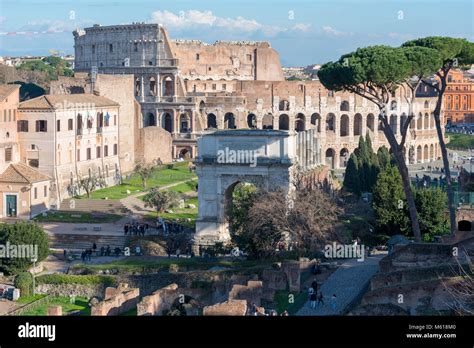 Roman Forum with Arch of Titus and Colosseum Stock Photo - Alamy