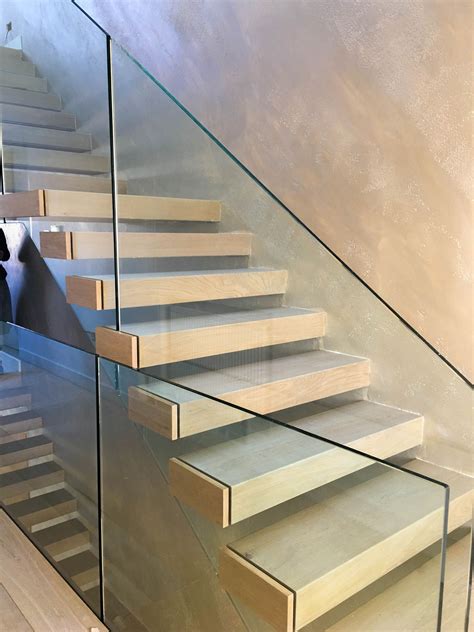 Floating stairs with frameless glass balustrade | Glass stair ...