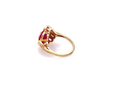 Lot - 10K YELLOW GOLD SYNTHETIC RUBY & QUARTZ RING