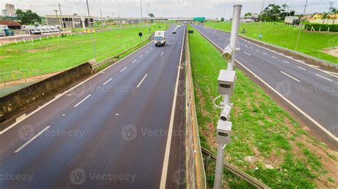 Traffic radar with speed enforcement camera in a highway. 7426949 Stock Photo at Vecteezy