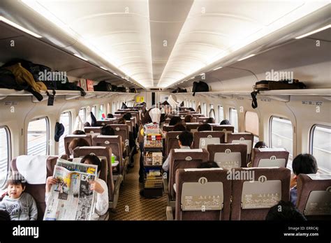 Interior of Shinkansen, Bullet train, carriage with three seats on one side, two on other and ...