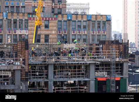 High-rise Building Construction Site with tradesmen Stock Photo: 73732678 - Alamy