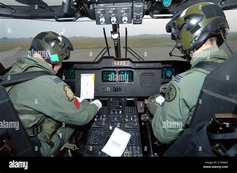 Pilots inside the cockpit of a Royal Air Force Merlin Helicopter at RAF ...