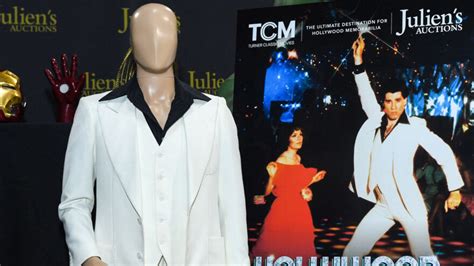 John Travolta’s iconic suit snatches a sweaty sum at auction - WYZA