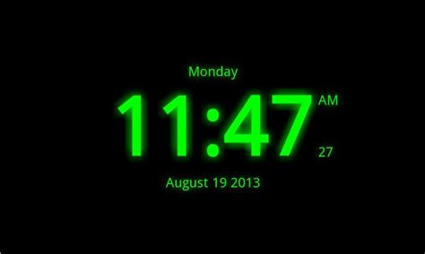 an alarm clock displaying the time in green on a black background with white border around it