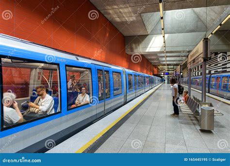 Inside The Metro Station In Munich. Train With Passengers In Modern ...