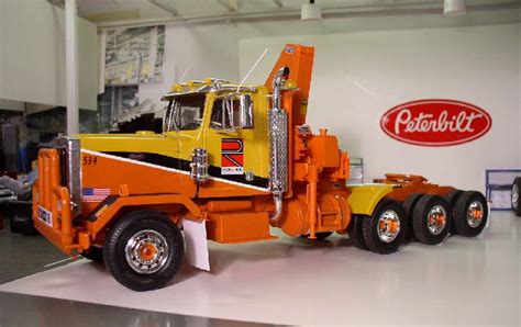 an orange and yellow truck is on display