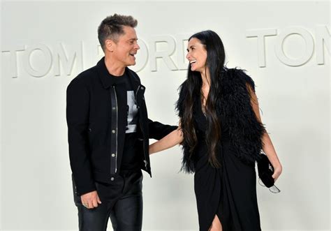 Demi Moore and Rob Lowe Share a Kiss at Fashion Show