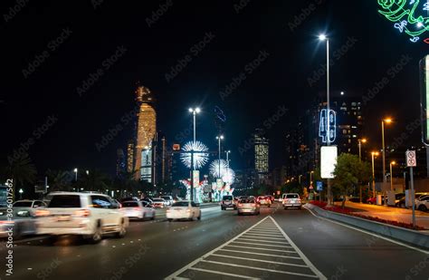 Abu Dhabi downtown Corniche road decorated for the UAE national day celebration at night Stock ...