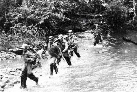 Laotian people's liberation army soldiers cross the river … | Flickr