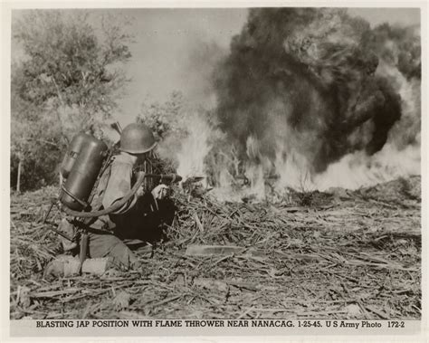 US Army soldier firing a flamethrower against Japanese forces near Nanacag, Philippines, 1945 ...