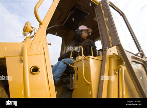 Female bulldozer operator Stock Photo - Alamy