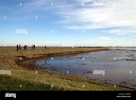 People walking the Suffolk Coastal path at Orford, Suffolk UK Stock ...