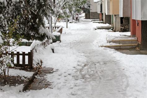 Winter. Ice. Snow. People Walks a Snowy Icy Road Passing Snowy Cars on Uncleaned Icy Street ...