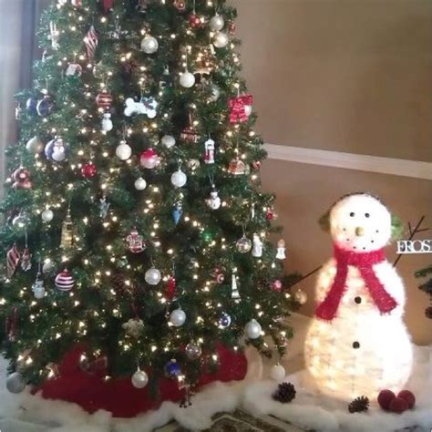 Bring outdoor decor inside. Fake snow and a snowman add to the ...