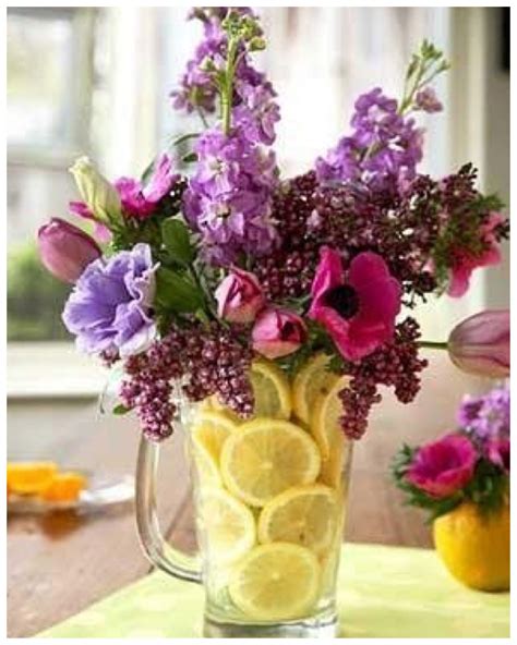 Lemon flower arrangement? Simply place a vase in a pitcher and fill ...