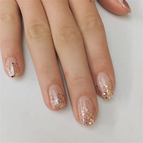 Looking for nail art ideas? Try a rose gold glitter ombre! Holiday nails. Nail ideas. Negative ...