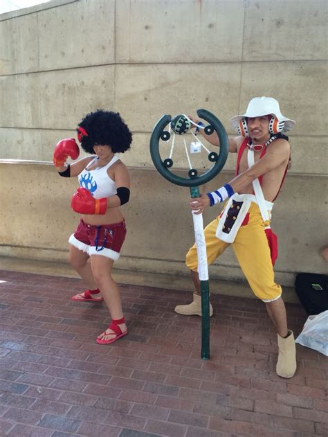 two people dressed up in costumes standing next to each other