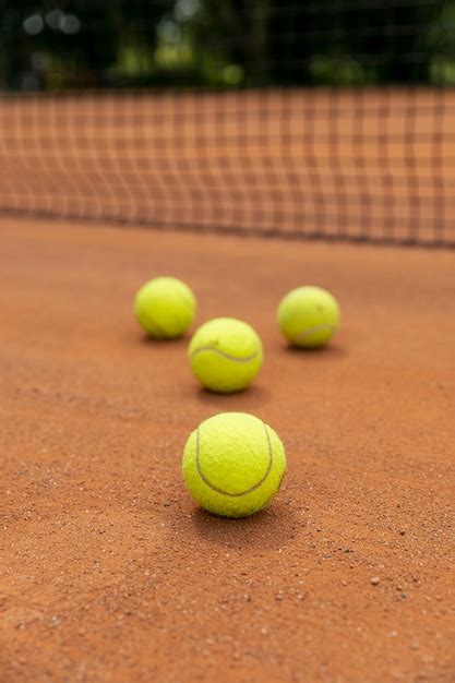 Free Photo | Close-up tennis balls on court ground