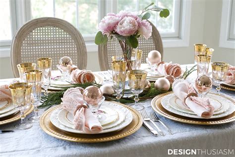 Elegant Holiday Table Setting with Gold and Pink Christmas Decorations