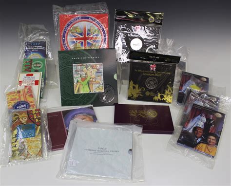 A collection of Royal Mint commemorative coins, including two London ...